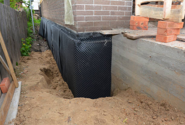 SJ Waterproofing Pros technician performing targeted Exterior Waterproofing assessment in Middleburg, VA